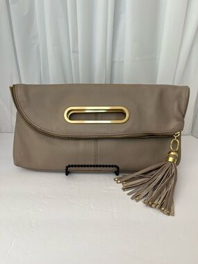 BCBG Taupe Fold-Over Leather Clutch with Gold Accent and Tassel